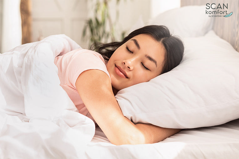 woman sleeping comfortably in bed