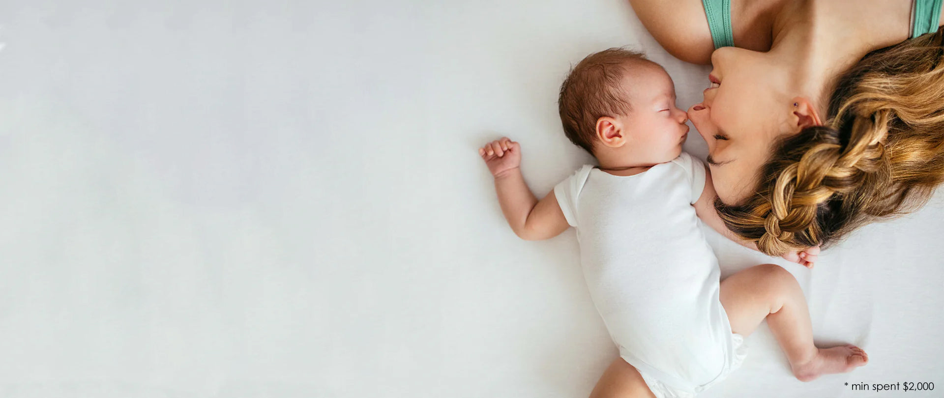 A mother and a baby sleeping on a premium mattress