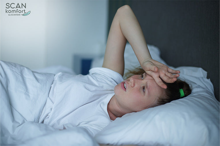 Woman Sweating while in bed