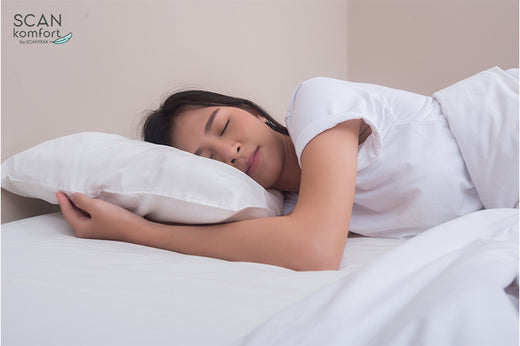 woman sleeping comfortably in bed