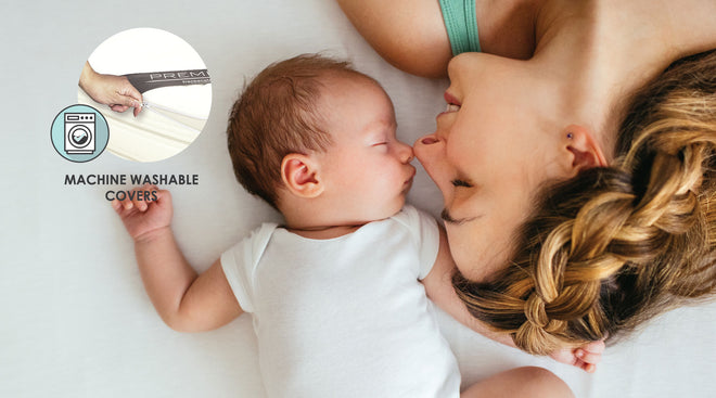 Image of Mother and infant on mattress with Machine washable covers indicated