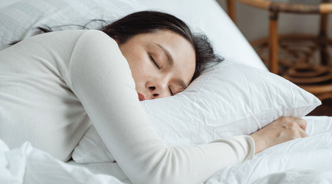 Image of woman sleeping on mattress